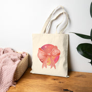 Pink/Yellow Planet Wrapped In A Bow Cotton Canvas Tote Bag