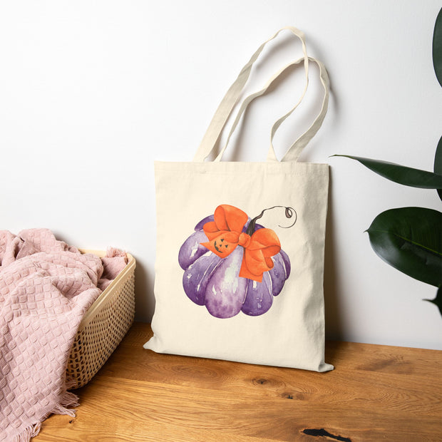 Purple Pumpkin Wrapped In A Bow Cotton Canvas Tote Bag